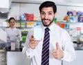 Satisfied man client in pharmacy