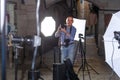 Portrait of satisfied photographer with his camera during photo shooting on town street Royalty Free Stock Photo