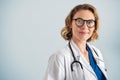 Portrait of satisfied and reliable mature female doctor Royalty Free Stock Photo