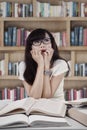 Portrait of scared student in library Royalty Free Stock Photo