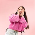 Portrait of the scared woman on pink Royalty Free Stock Photo