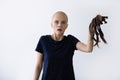 Scared sick bald woman struggling with cancer lose hair