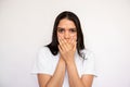 Portrait of scared young woman covering mouth with hand Royalty Free Stock Photo