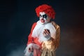 Portrait of scary bloody clown with crazy eyes Royalty Free Stock Photo
