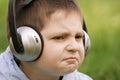 Portrait of sceptic boy in headphones