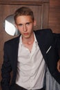 Portrait of School Boy. Dressing formally in black suit, necktie