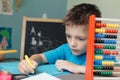 Portrait of a school boy working on math homework Royalty Free Stock Photo
