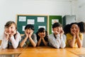 Portrait of school children smiling in classroom Royalty Free Stock Photo