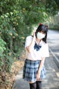 Asian school girl with mask in walkway city Royalty Free Stock Photo