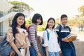 Portrait of School kids with backpacks smiling standing in elementary school hallway Royalty Free Stock Photo