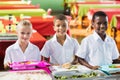 Portrait of school kids having lunch during break time Royalty Free Stock Photo