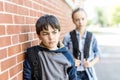 Portrait of school 10 years boy and girl having fun outside