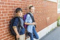 Portrait of school 10 years boy and girl having fun outside Royalty Free Stock Photo