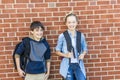 Portrait of school 10 years boy and girl having fun outside