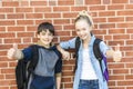 Portrait of school 10 years boy and girl having fun outside Royalty Free Stock Photo