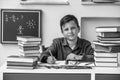 Portrait of school young student doing homework. Black and white photo. Royalty Free Stock Photo