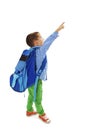 Portrait of a schoolboy with backpack is pointing up Royalty Free Stock Photo