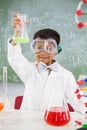 Portrait of schoolboy doing a chemical experiment in laboratory Royalty Free Stock Photo