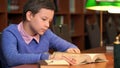 Portrait of schoolboy doing their homework in library or room Royalty Free Stock Photo