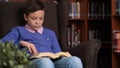 Portrait of schoolboy doing their homework in library or room Royalty Free Stock Photo