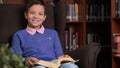 Portrait of schoolboy doing their homework in library or room Royalty Free Stock Photo