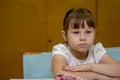 Portrait of a schoolgirl at a desk