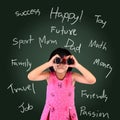 Portrait of a schoolgirl standing over blackboard