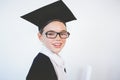 Portrait of schoolkid pretending to be graduate