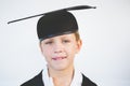 Portrait of schoolkid pretending to be graduate