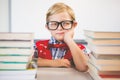 Portrait of schoolkid pretending to be a teacher in classroom