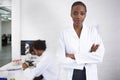 Portrait, science and black woman arms crossed in laboratory for innovation or research development. Healthcare