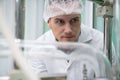 Portrait of a scientist, apothecary extracting cannabis oil in laboratory.