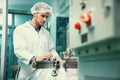 Portrait of a scientist, apothecary extracting cannabis oil in laboratory.