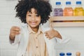 Portrait Scientist Kid in school with science lab kit. Learning education black child girl happy smiling thumbs up Royalty Free Stock Photo