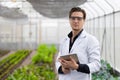 Portrait Scientist male researcher staff worker collecting study plant information in agriculture farm. Agricultural Science