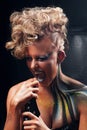 Portrait of screaming punk woman with body art Royalty Free Stock Photo