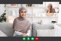 Muslim Women Wearing Headscarf Having Video Call Royalty Free Stock Photo