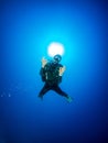 Portrait of a scuba diver in the deep blue sea