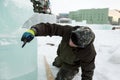 Portrait of a sculptor at work with a chisel