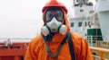 Portrait of a sea worker wearing a gas mask on the background of a sea vessel. Generative AI
