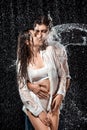 portrait of seductive couple swilled with water
