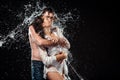 portrait of seductive couple with water splash