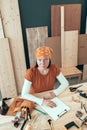 Portrait of self employed female carpenter in her woodwork workshop