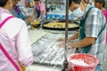 Portrait of seller cooking deep fried flour called Pa-Tong-Ko