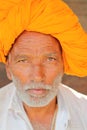 BUNDI, RAJASTHAN, INDIA - DECEMBER 08, 2017: Portrait of a seller with a nice turban and clear eyes at the vegetable market