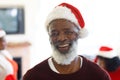 Portrait of senior african american man wearing santa hat Royalty Free Stock Photo