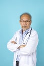 Portrait of senior Asian doctor with serious face standing Royalty Free Stock Photo