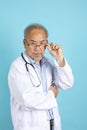 Portrait of senior Asian doctor with serious face standing Royalty Free Stock Photo