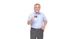 Senior asian man holding credit card and showing on hand isolated on white background Royalty Free Stock Photo