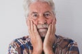 Portrait of senior bearded man alone and desperate - white background